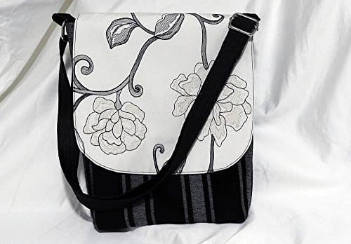 Designer fabric crossbody bag. Adjustable shoulder strap.