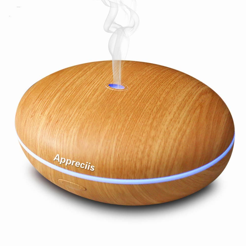 Essential Oil Diffuser By Smiley Daisy® - Best Whisper-Quiet Cool Mist Humidifier - Enjoy Aromatherapy Experience with Your Favorite Scented Essential Oils - Free eReport Download - Ultrasonic Vaporizer with Excellent Mist Disperse Rate - Enlightening 7 Color Changing LED Lamp - Candle Burner Replacement - Oval-Shaped Oil Diffuser with Elegant Finish Housing - 180-Day Product Replacement Warranty When You Purchase with Smiley Daisy (Walnut Brown)
